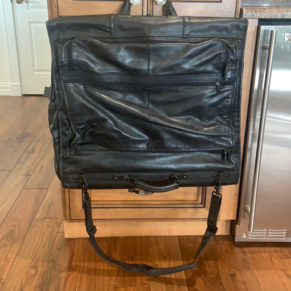 Tumi  black leather garmet bag